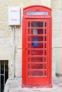 Red telephone cabin at Victoria in Gozo island, Malta Royalty Free Stock Photo