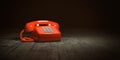Red telephone on dirty background. Vintage retro push button telephone