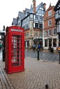 Red telephone kiosk in old part of Chester