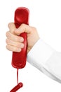 Red telephone receiver with hand Royalty Free Stock Photo