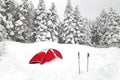 Red tent and hiking sticks, natural snow hill in Japan Yatsugatake mountains