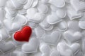 Red textile heart on white hearts background