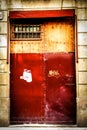 Red textured door in Barcelona Spain Royalty Free Stock Photo