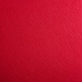 Red textured surface with a slightly rough and fibrous appearance. The color is vivi Royalty Free Stock Photo