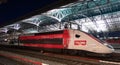 Red TGV Lyria highspeed train in Lausanne, Switzerland with exciting color play Royalty Free Stock Photo