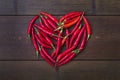 Chili heart on bamboo background Royalty Free Stock Photo