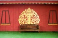 Red Thai patterned wooden wall