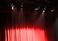 red theater curtain over the stage and the lights overhead projectors Royalty Free Stock Photo