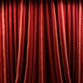 Red theater curtains with beautiful pleats. Background with velvet curtain.