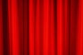 Red stage curtain with folds, fabric texture