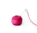 Red thread ball and needle with red thread isolated on white Royalty Free Stock Photo