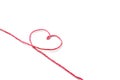 Red thread and heart isolated on white background Royalty Free Stock Photo