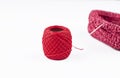 Red thread, heart shaped basket and needle isolated on white background. Copy space Royalty Free Stock Photo