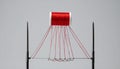 Red Thread Unifying a Row of Needles Royalty Free Stock Photo