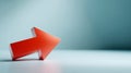 Red three-dimensional arrow pointing right on a smooth light blue surface with soft gradient background Royalty Free Stock Photo