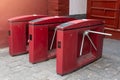 Red three tripod turnstile metal gates entrance for access control in China. Entrance or exit turnstile tripod and ticket reader Royalty Free Stock Photo