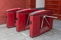 Red three tripod turnstile metal gates entrance for access control in China. Entrance or exit turnstile tripod and ticket reader