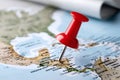 Red thumbtack marking a destination on world map Royalty Free Stock Photo