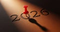 Red thumbtack pins the year 2026 casting a shadow Royalty Free Stock Photo