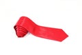 A red tie rolled on white background close-up view Royalty Free Stock Photo