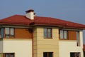 Red tile on the roof of the attic of a large private house