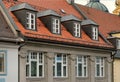 Red tile roof and gabled dormer windows in Munich, Germany