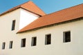 Red tile roof on an old house with latticed windows Royalty Free Stock Photo