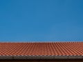 Red tile rooftop on blue sky background Royalty Free Stock Photo