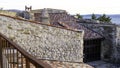 Red tiled roofs with stone walls and chimneys Royalty Free Stock Photo