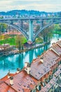 Red tiled roofs of townhouses of old Bern and Kirchenfeldbrucke bridge on background, Switzerland