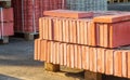 Tiles piled in pallets, warehouse paving slabs in the factory for its production