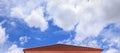 Red tiles roof and blue sky background Royalty Free Stock Photo