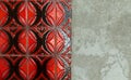 Red tiles wall besides cracked and destroyed undersurface Royalty Free Stock Photo