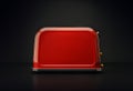 Red toaster on a dark background. Kitchen equipment