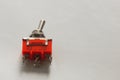 Red toggle switch isolated on white background