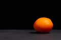 Red tomato on a black and gray background Royalty Free Stock Photo