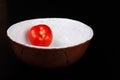 Red tomato on the ceramic bowl prepared for salad Royalty Free Stock Photo