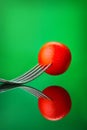 Red tomato on fork Royalty Free Stock Photo