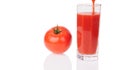 red tomato and glass with tomatoes juice isolated on the white background Royalty Free Stock Photo