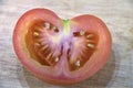 Red tomato slice with seeds Royalty Free Stock Photo