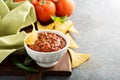 Red tomato spicy salsa with chips