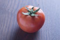 red tomato on wooden background