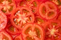 Red tomatoes background. Top view. Healthy natural food, background. Tomatoes slices. Group of ripe tomatoes forming a backgroundR Royalty Free Stock Photo