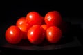 Red Tomatoes in front of black background