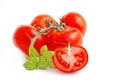 Red tomatoes and green basil ilisolated on white background.