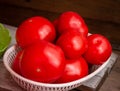 Red tomatoes in a plastic basket. Sale of tomatoes at the farmers\' market. Red ripe tomatoes Royalty Free Stock Photo
