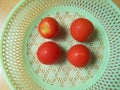 Red Tomatoes.Red tomatoes are in reverse in a plastic basket Royalty Free Stock Photo