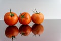 Red tomatoes on white background