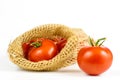 Red tomatoes on a white table. Tasty vegetables for the best dis