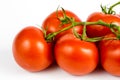 Red tomatoes on a white table. Tasty vegetables for the best dis